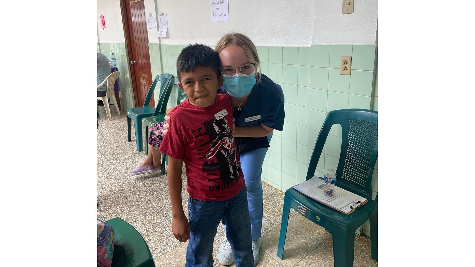 Alison Reynolds with a child patient in Guatemala